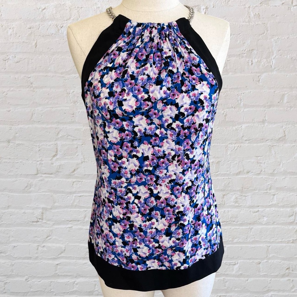 Cache Silk Halter Sleeveless Tank Top In A Floral Print on a Black Background